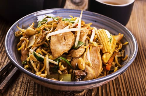 Wok de canard du Mékong, huile de sésame et ciboulette
